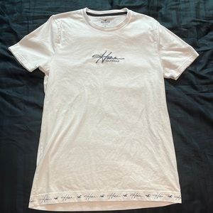 Hollister white shirt with details on the bottom